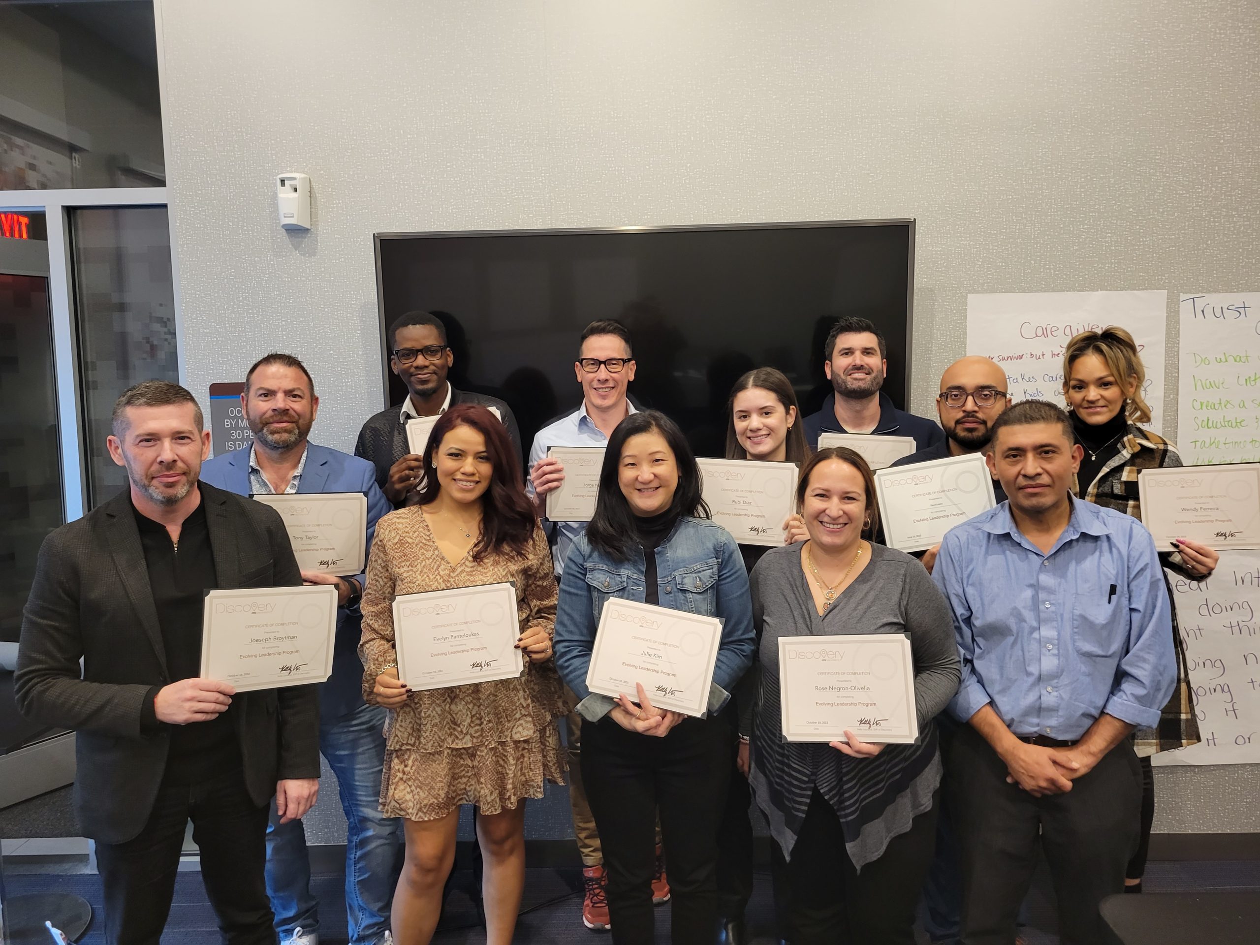 group of managers who just finished leadership training with certificates